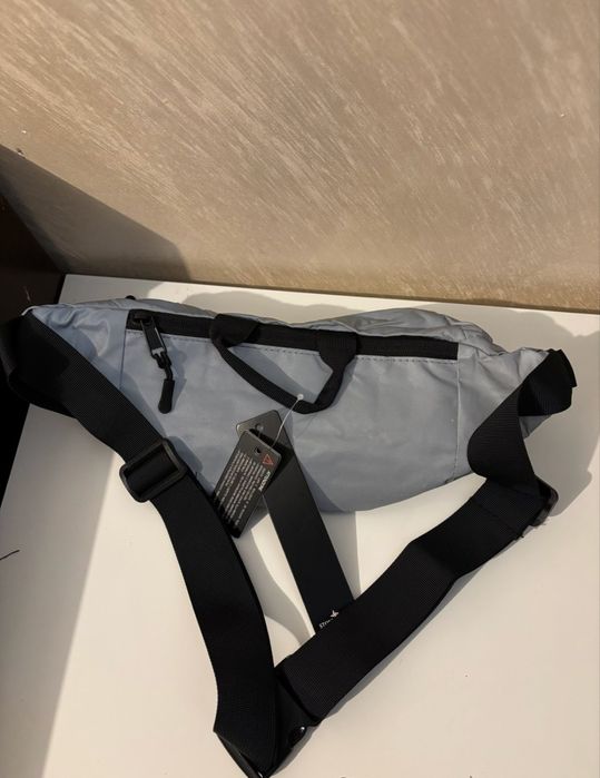 Stone island silver reflective bag
