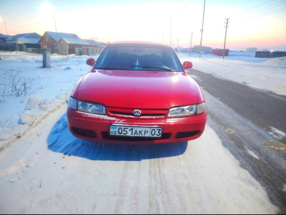 Мазда кронус на ходу.