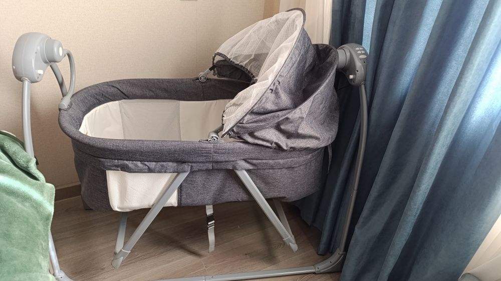 Детская кроватка с функцией укачивания и музыкой