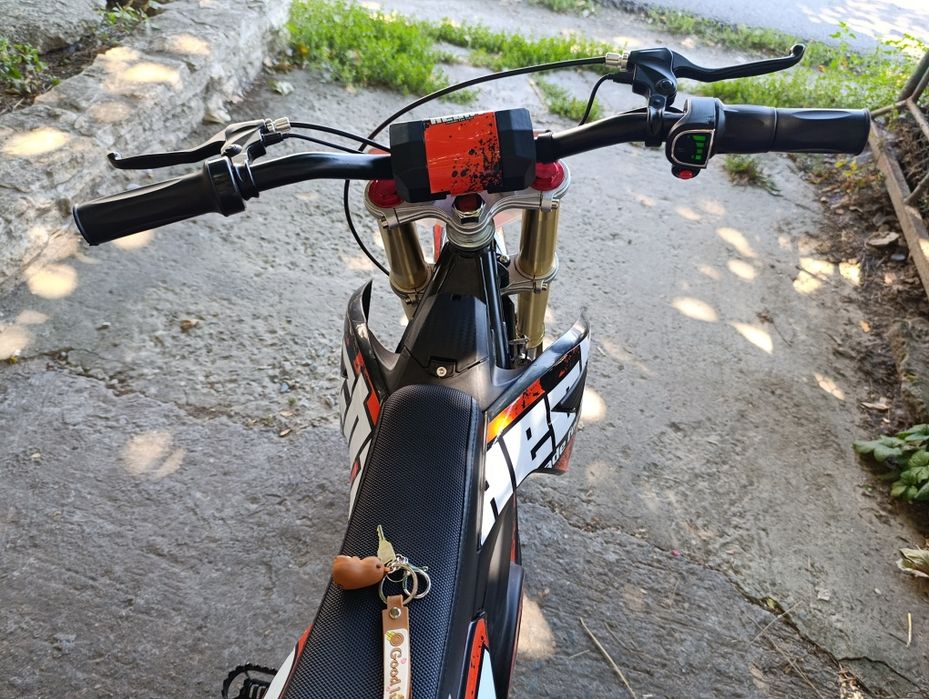Motocicleta electrica copii Eco Tiger 1000W pentru copii 6-12 ani, 36V, roti 12/10, culoare portocalie, ideala pentru aventuri off-road