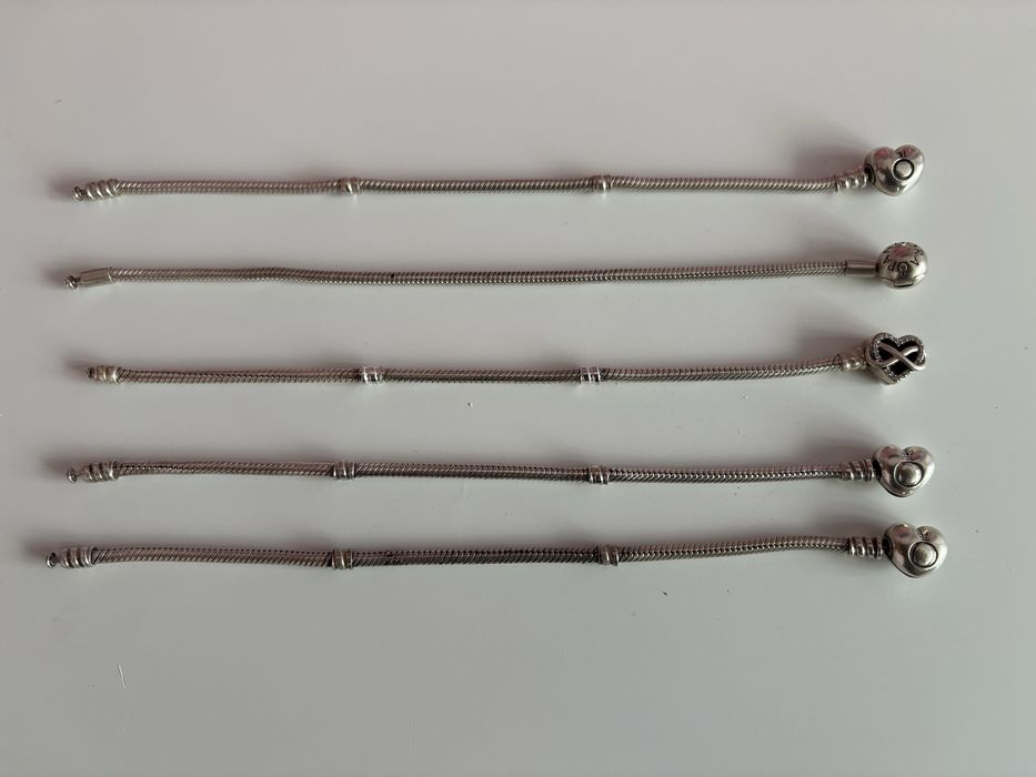 Гривни и талисмани Pandora