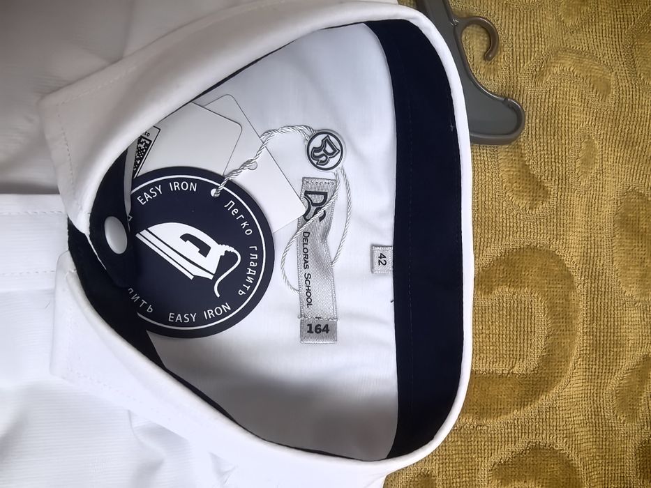 Продам новую  рубашку 164см