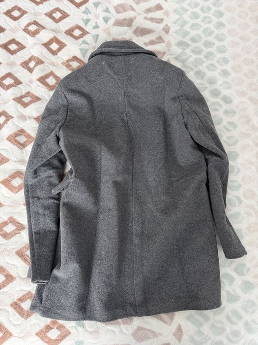 Palton nou ci eticheta