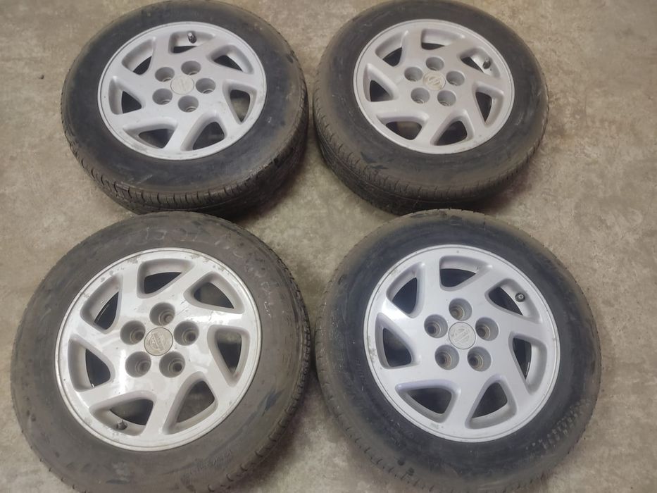 Оригинальные литые диски Nissan Maxima R15 5×114.3 с шинами 195/65 R15