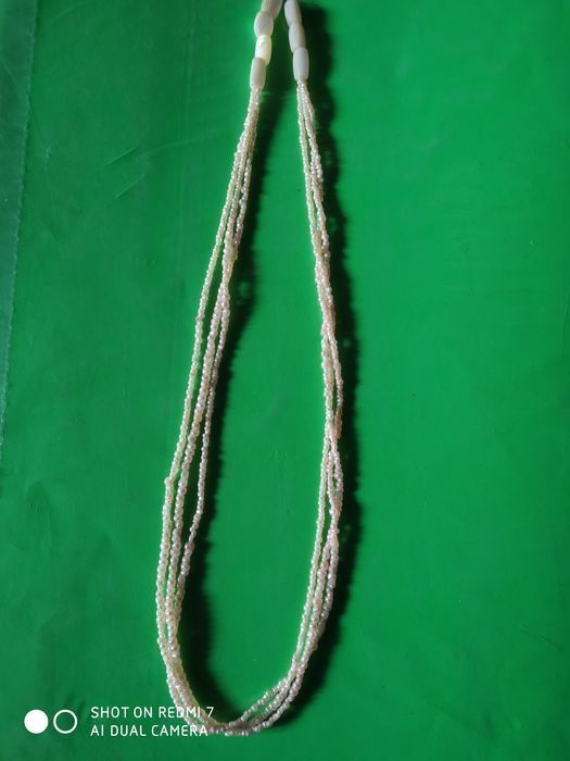 Кадимий ноеб такинчок. Соф денгиз  марвариди ва дурдан иборат.