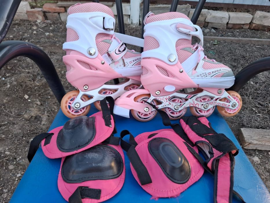 Роликовые коньки