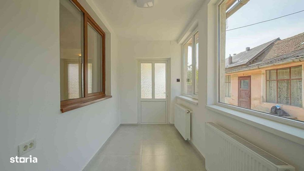 Casă renovată în Feldioara Brasov cu încălzire în pardoseală