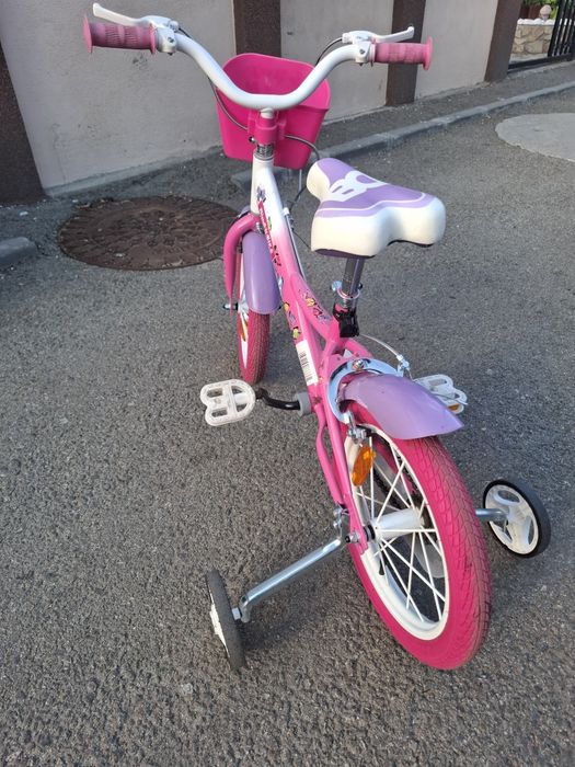 Vând bicicletă roz roți pe 14