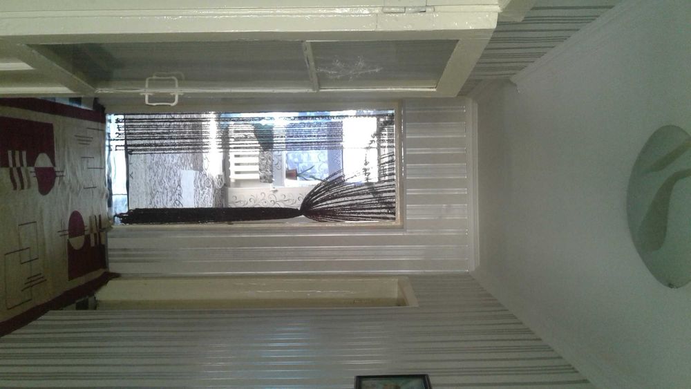 Коттедж зади ЦУМа