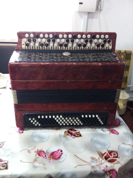 Гармонь трех рядка