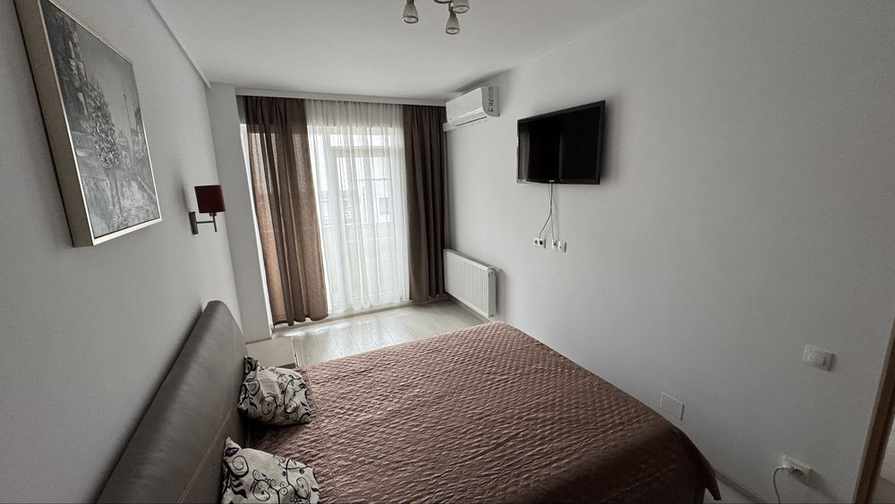 Inchiriez apartament 2 camere zona centrala str traian mobilat modern cu parcare subterana inclusa etaj3 bloc nou