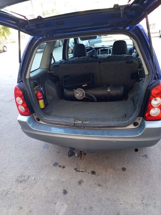 Кола Mazda Tribute