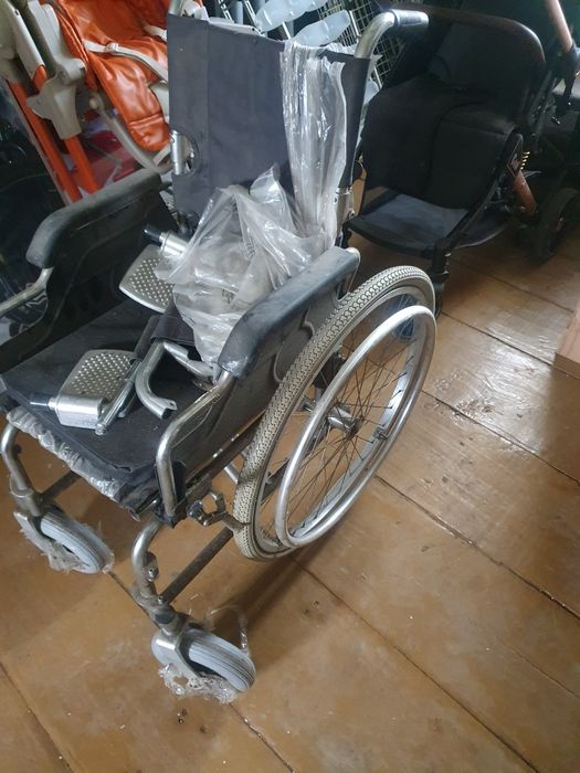 Инвалидная коляска.