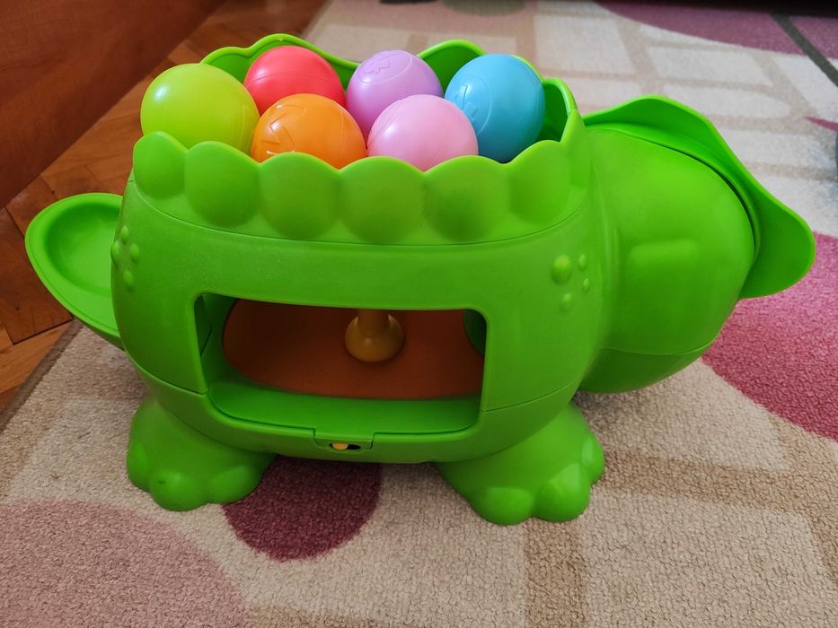 Играчка динозавър с топчета Fisher Price
