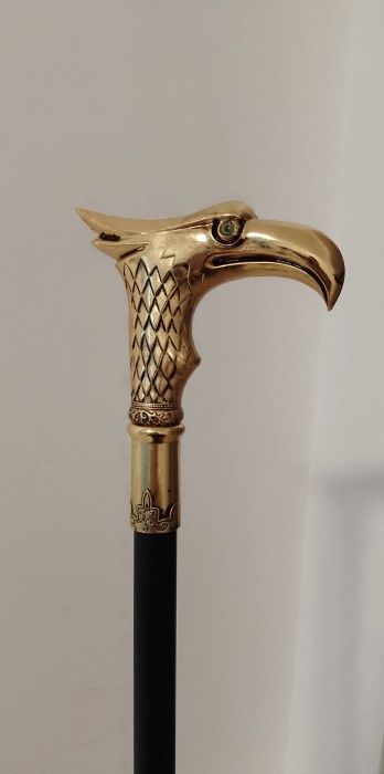 Baston cu mâner cap de vultur din bronz ,piesa cu o lucrătură de o foa