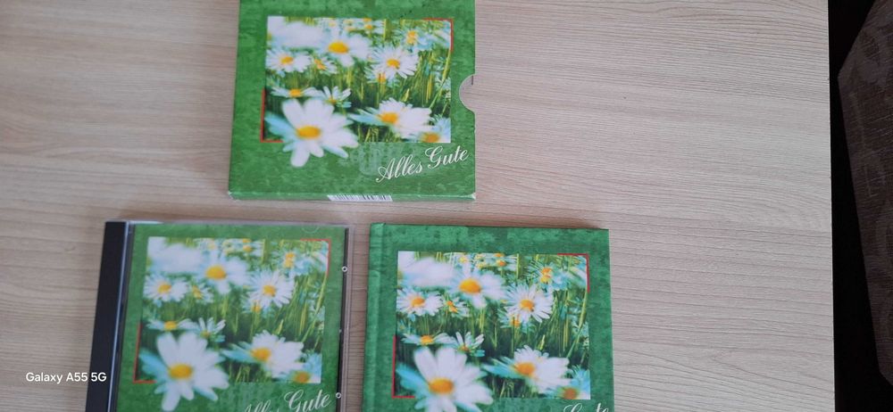 Set Cd+Album , in lb. Germană,  nou