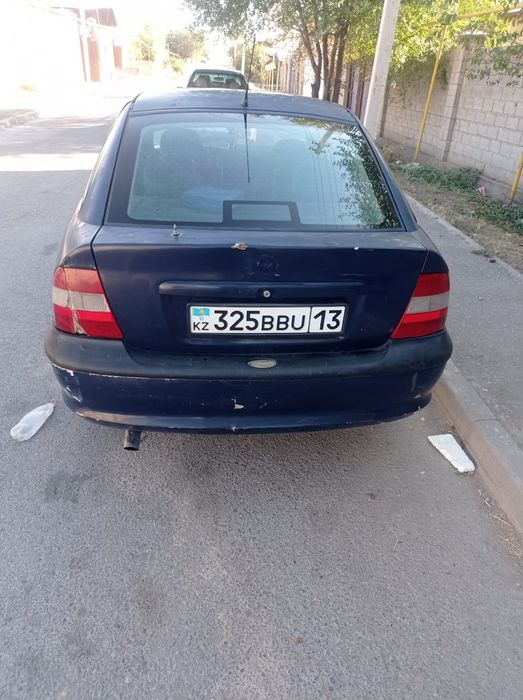 Машина Опел сатам