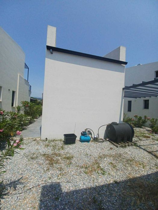 Продава нова лукс къща 72 м2 двор 557 м2 в Паралия Каряни, Гърция