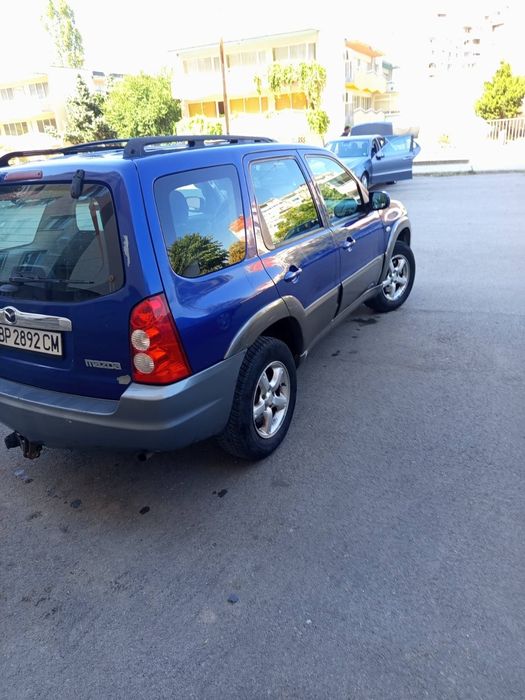 Кола Mazda Tribute