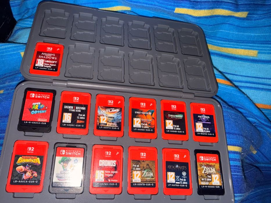 Nintendo Switch 2 + Accesorii + Jocuri (13 cartridge + cont digital) | Accept și schimburi