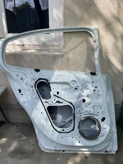 Portieră stânga spate Dacia Logan 2021 – albă, fără accesorii