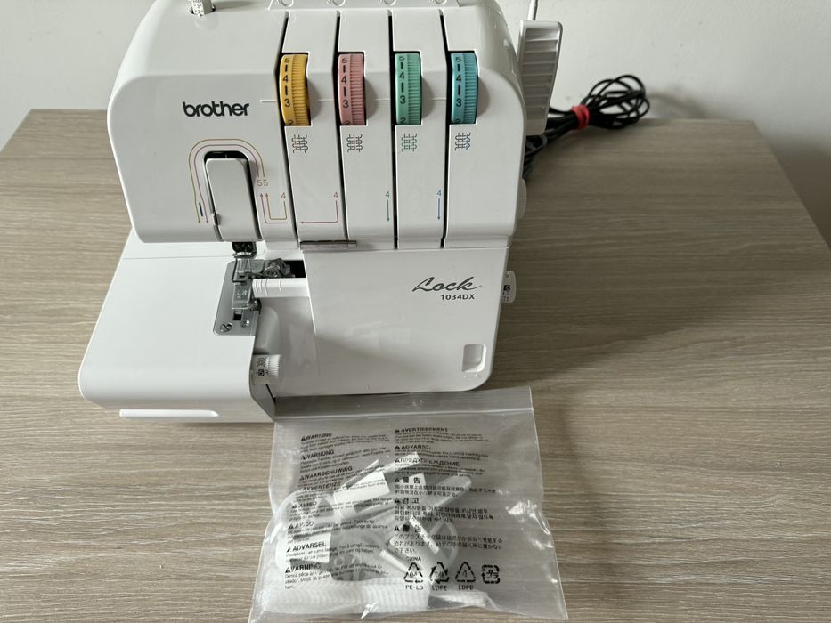 Vand masina de festonat Brother 1034DX