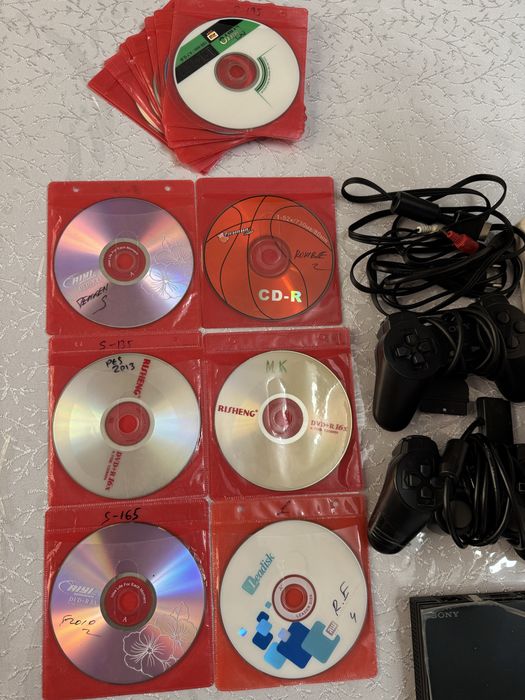 PlayStation 2 Slim yangidek holatda
