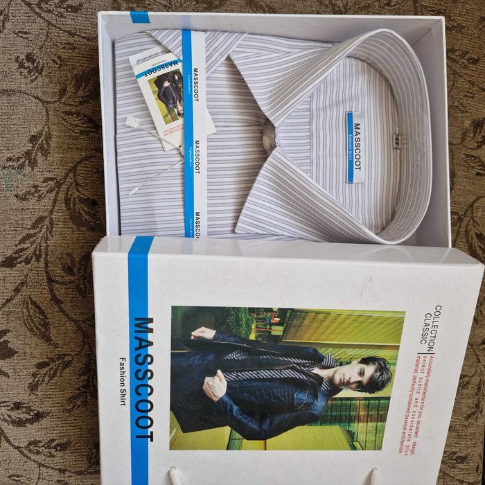 Продам костюмы и рубашки