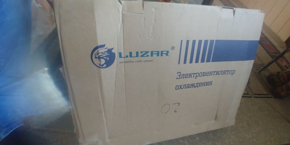 Вентилятор в сборе на логан 1