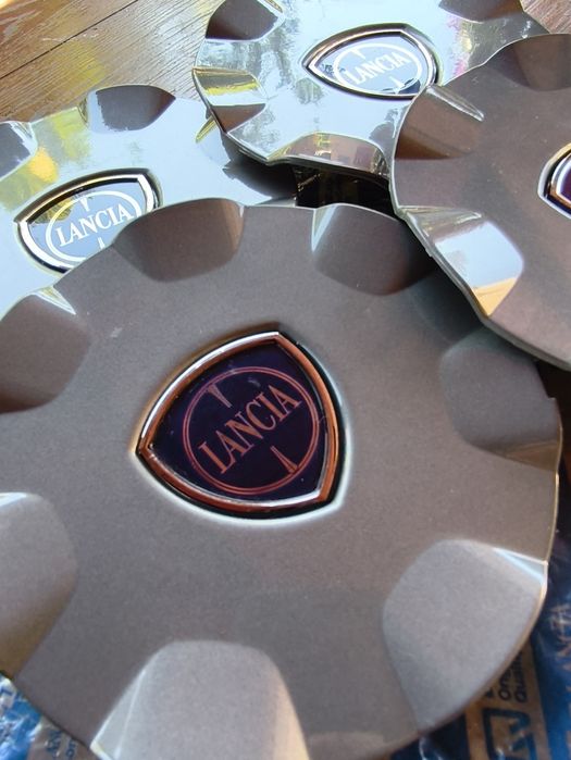 Set 4 capace centrale jante aliaj  Lancia (Delta,  Ypsilon)