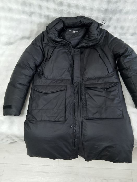 Продам пуховик, размер на 58.