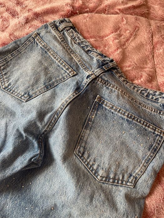 Блестящи сини дънки MANGO