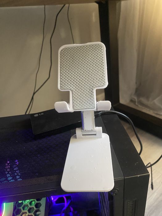 Подставка для телефона джостика.