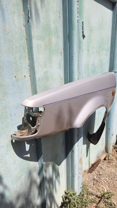 Крыло водительской стороны мазда 323