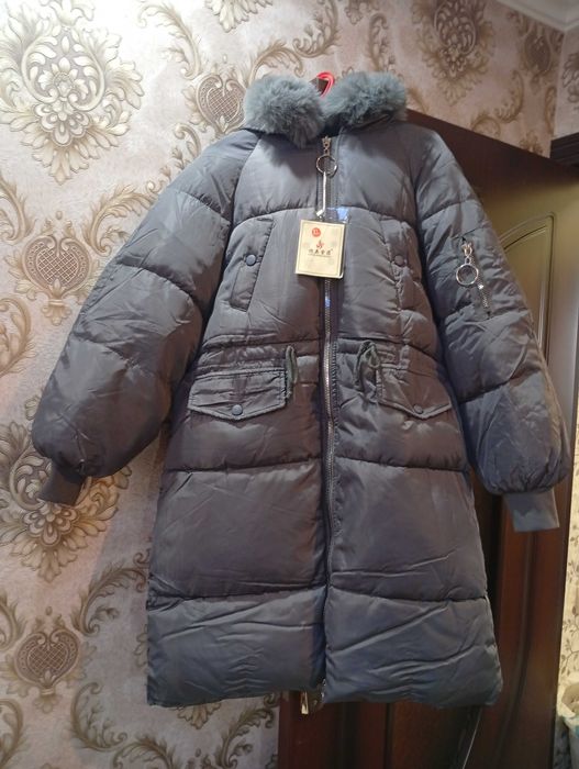 Женский пуховик .