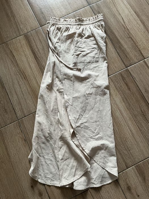 Pantaloni largi cu crăpătură și buzunare