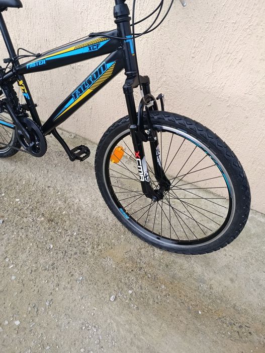 Vând bicicletă copii cu roți pe 24.