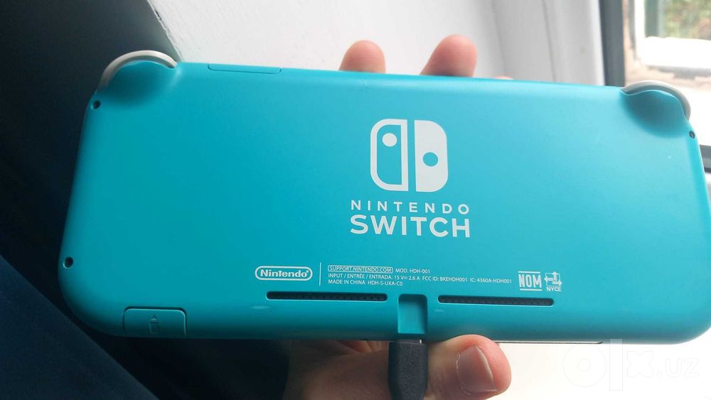 Nintendo Switch Lite (Бирюзовый/Синий) + чехол + 8 игр