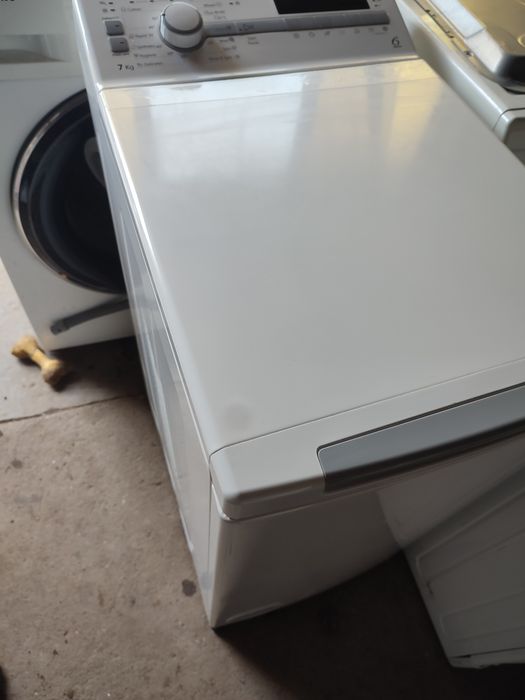 Vând masina de spălat verticala 390 Ron