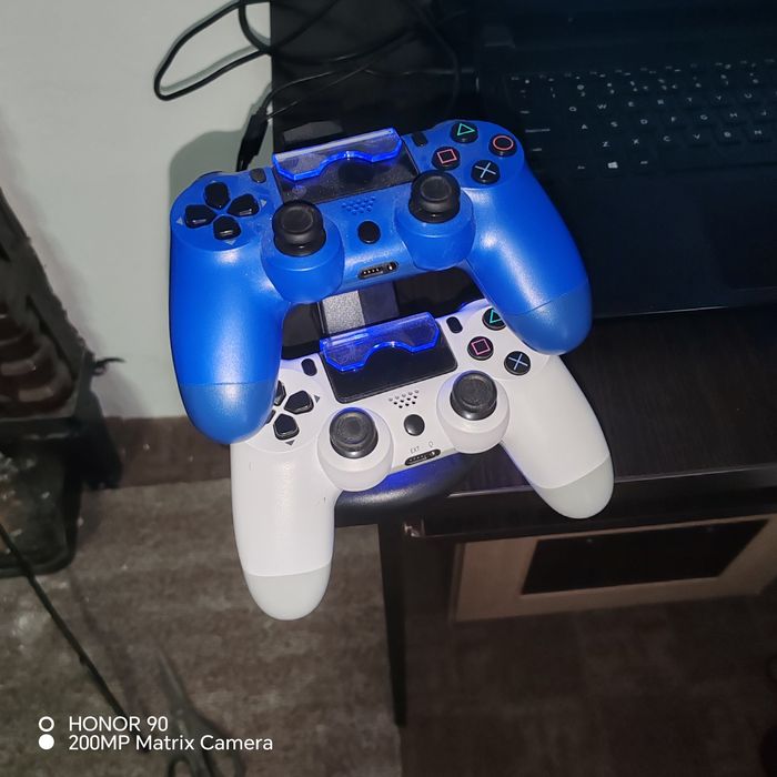 PS4 Slim + 2 manete + 7 jocuri – pachet complet, gata de joc