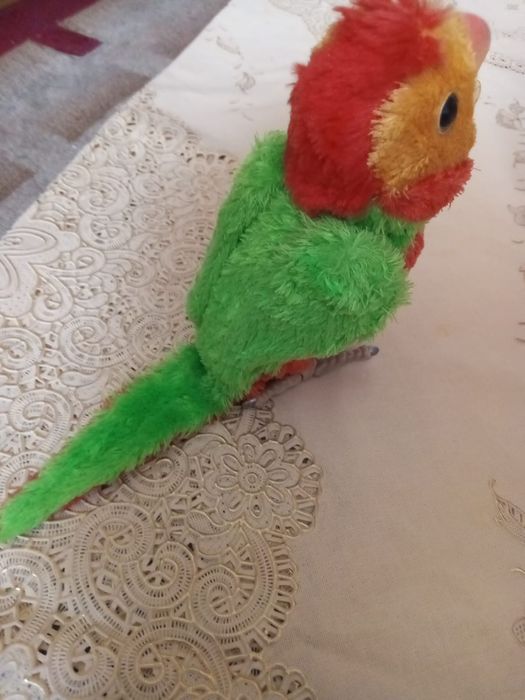 Игрушка попугай в отличном состоянии