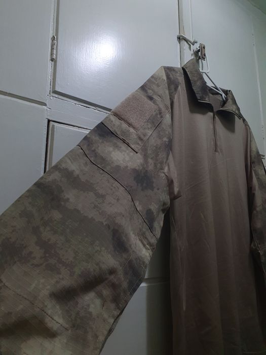 Bluză tactică de la  101 INC pe camuflaj Atacs AU