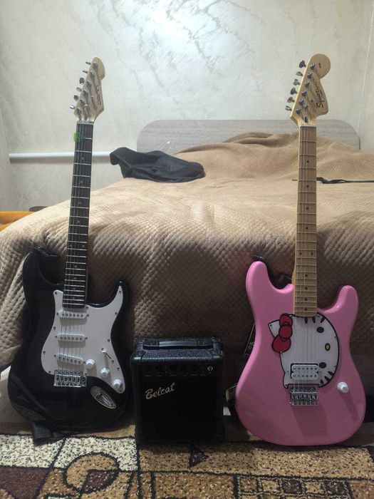 Продаю одну электрогитару с комбиком чорная*