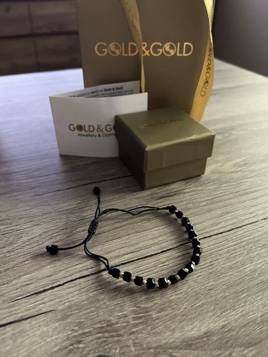 Златна гривна с оникс