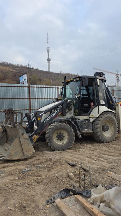 Услуги экскаватора-погрузчика