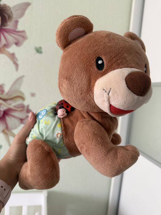 Продам игрушку ползающий мишка