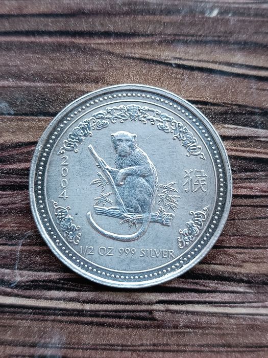 Серебряная монета 50 центов. 2004 года