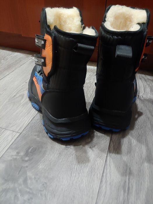 Продам новые зимние ботинки