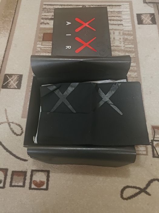 KAWS x Air Jordan 4 Retro Cool Grey