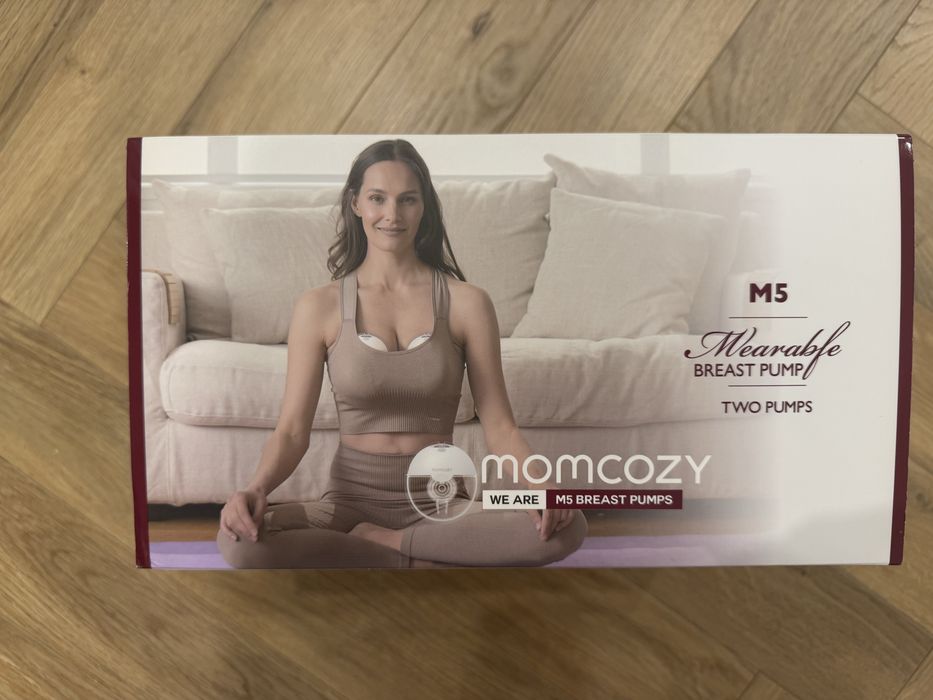 Продам автоматический молокоотсос Momcozy